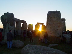 setting sun through the stones at Stonehenge