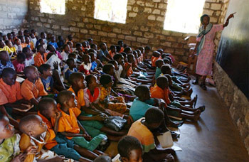 Kids seated on the floor in a classroom in Kenya