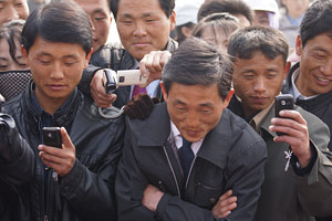 Korean men with cellphones
