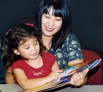 Mother reading with her child