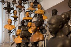 busts of humans in various shades of brown