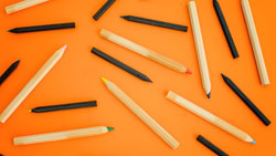 pencils on an orange background