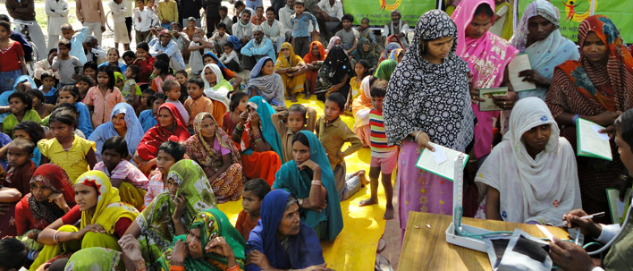 People seated at a diabetes screening event in India. 