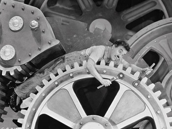 Charlie Chaplin as a cog in Modern Times