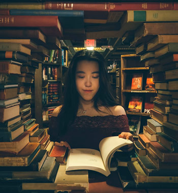 girl surrounded by books