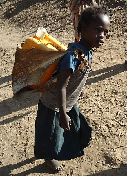 child carrying heavy load