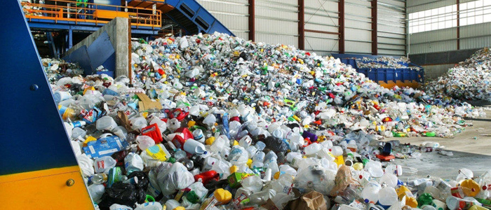 A large pile of plastic products in a plastic recycling factory.