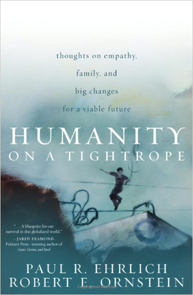 The book cover of Ornstein and Ehrlich's 'Humanity on a Tightrope' showing a man balancing on a high-wire.