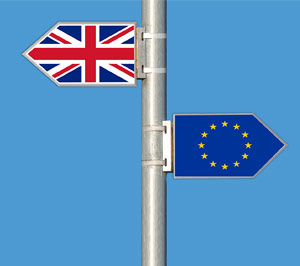 A signpost showing a UK and EU flag, indicating Brexit and drift apart.