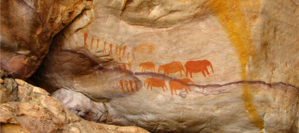 The Cederberg rock paintings showing a collection of humans and mammals in South Africa.