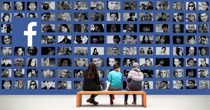 Three young people sitting in front of a large screen showing many Facebook profiles.